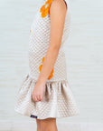 Beige Quilted Silk Dress with Orange Floral Appliqué – Perfect for Celebrations